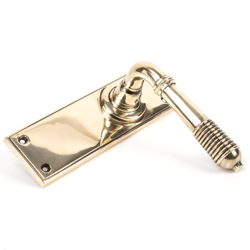 White background image of From The Anvil's Aged Brass Reeded Lever Latch Set | From The Anvil