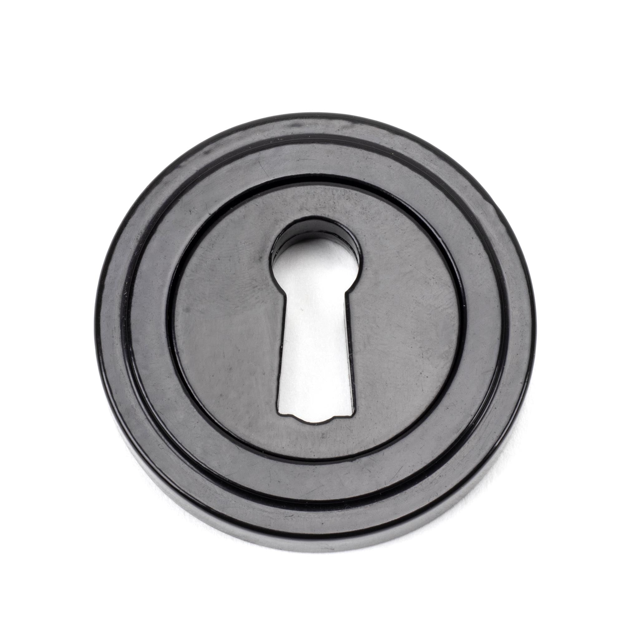 From The Anvil's Black Round Escutcheon