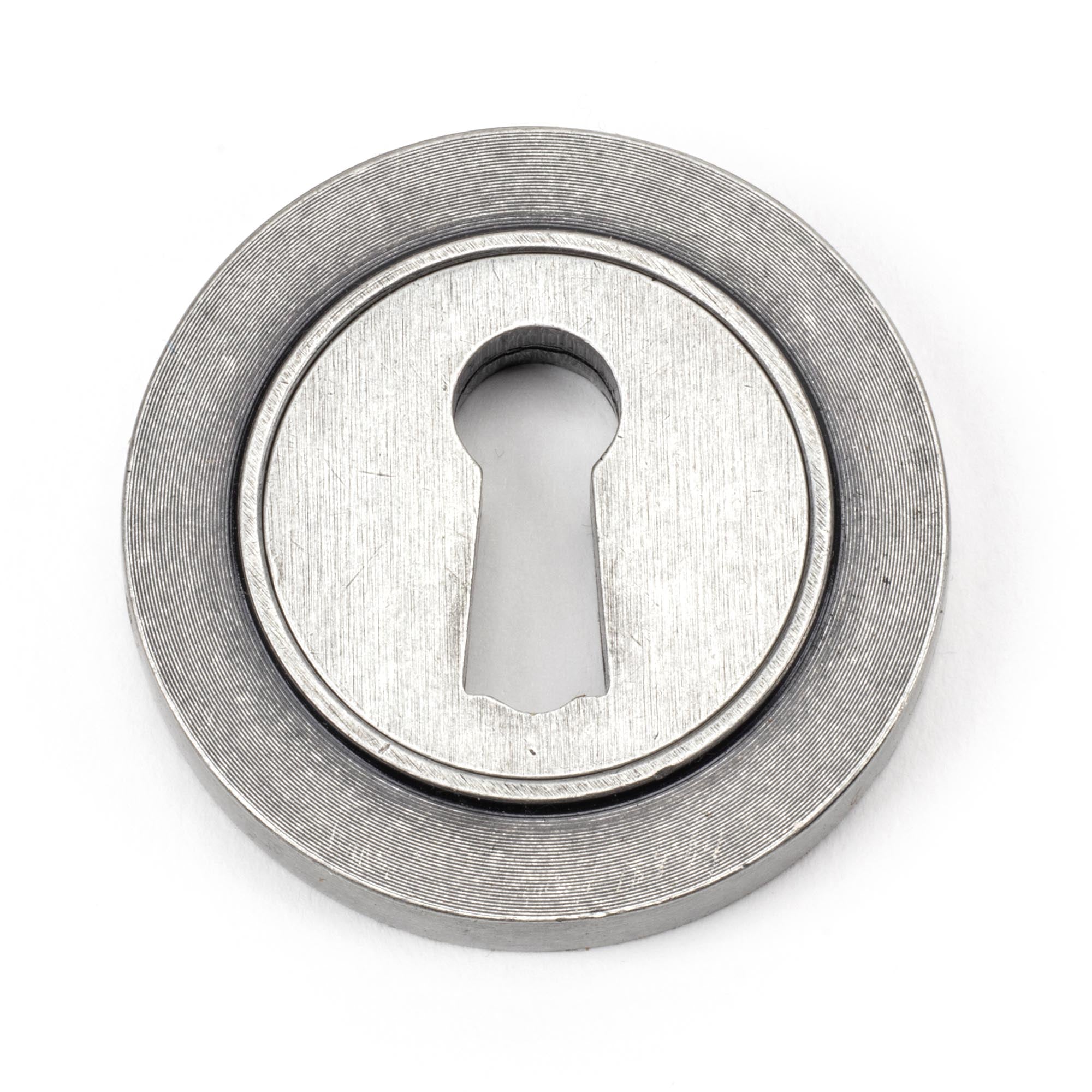 From The Anvil's Pewter Patina Round Escutcheon