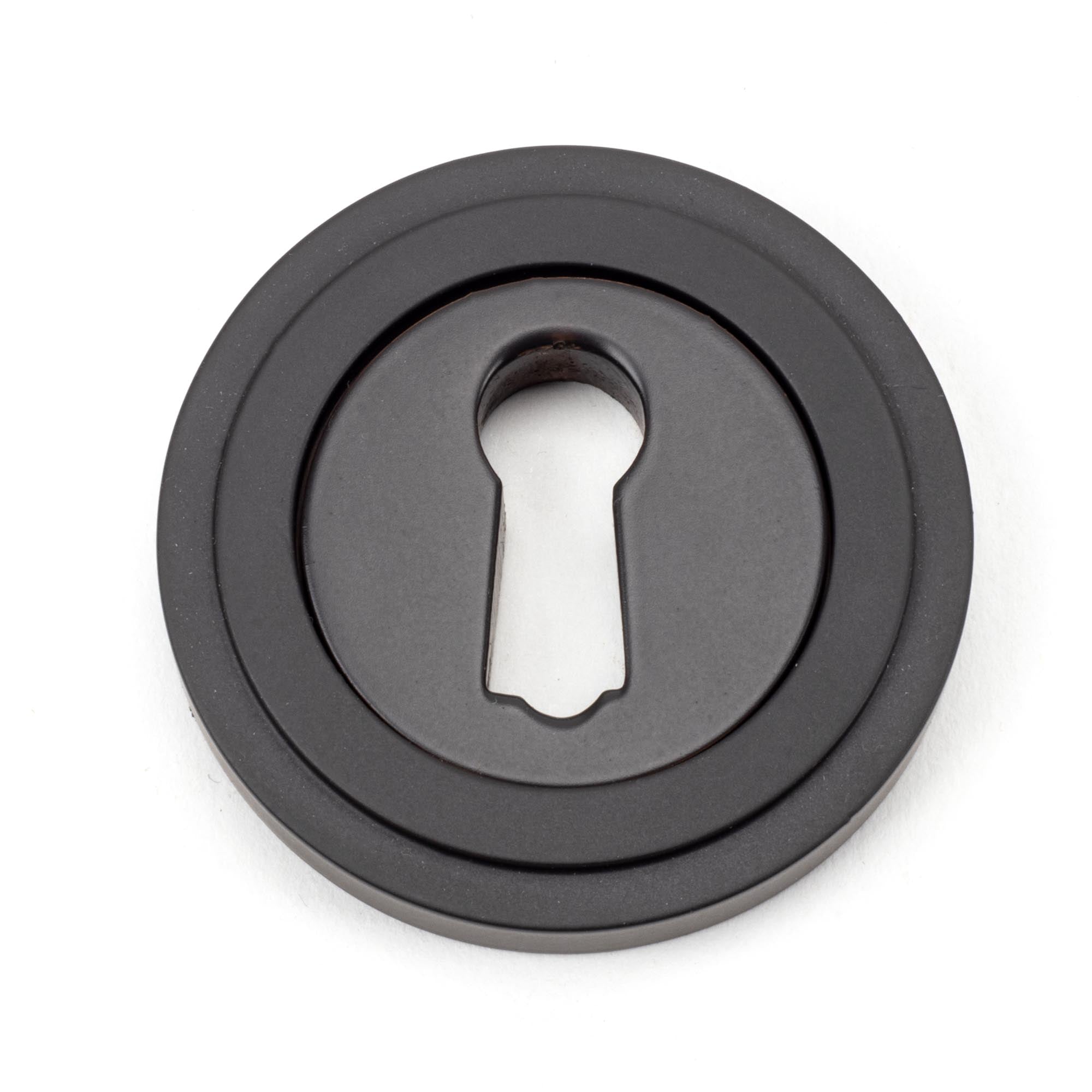From The Anvil's Aged Bronze Round Escutcheon
