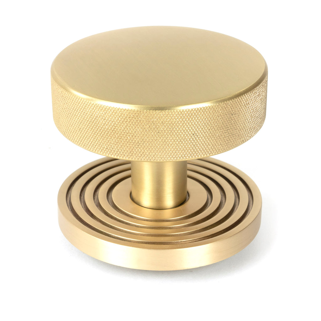 White background image of From The Anvil's Satin Brass Brompton Centre Door Knob | From The Anvil