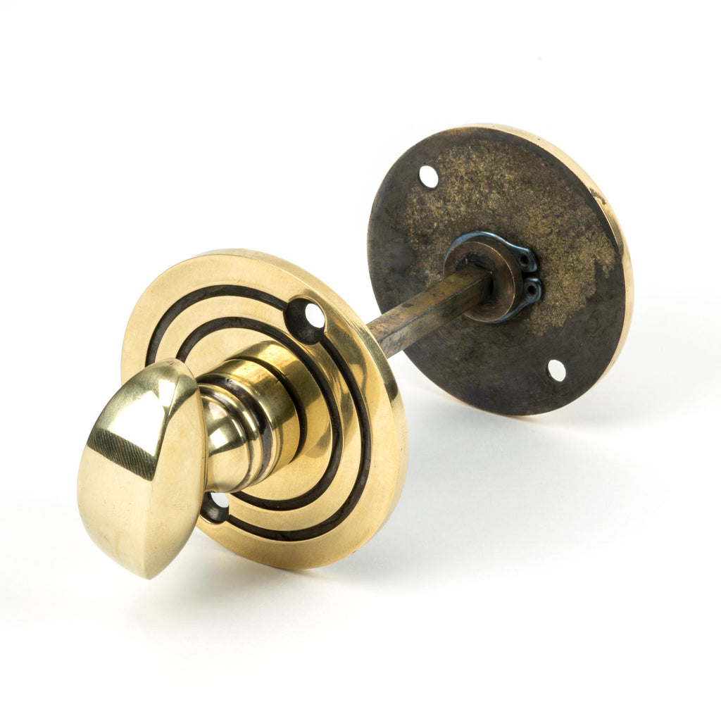 White background image of From The Anvil's Aged Brass Round Thumbturn Set | From The Anvil