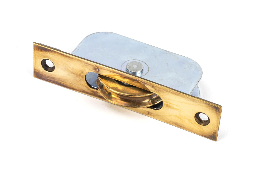 White background image of From The Anvil's Aged Brass Square Ended Sash Pulley 75kg | From The Anvil