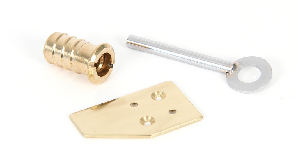 White background image of From The Anvil's Polished Brass Key-Flush Sash Stop | From The Anvil