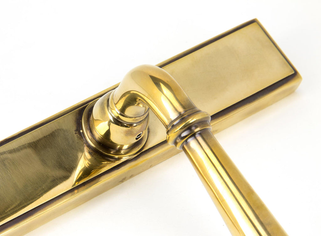 White background image of From The Anvil's Aged Brass Newbury Slimline Lever Espag. Lock Set | From The Anvil