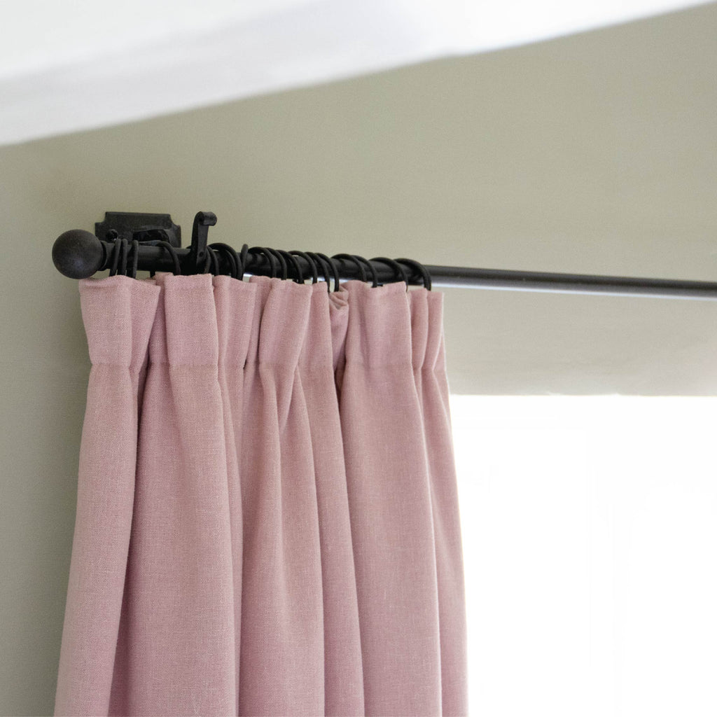 From The Anvil Beeswax curtain pole and curtain rings with pink curtain