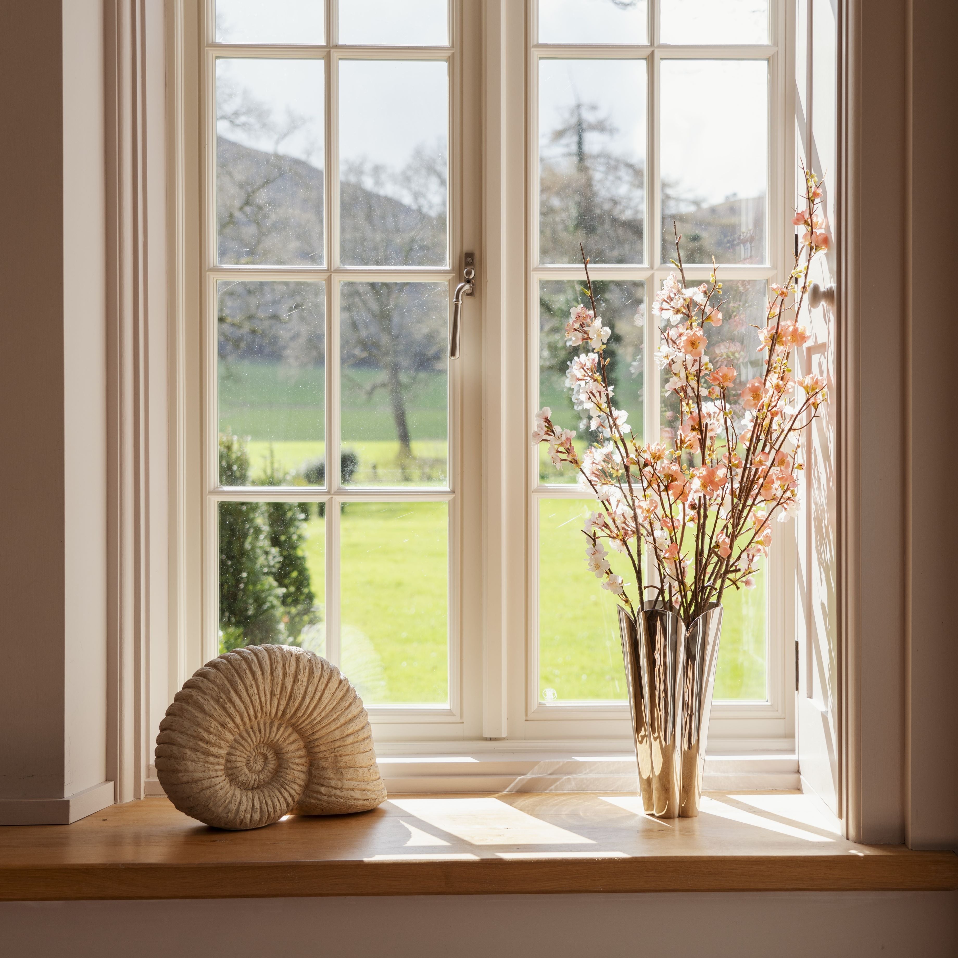 From The Anvil Polished Chrome window handle hardware and Flora flower vase.
