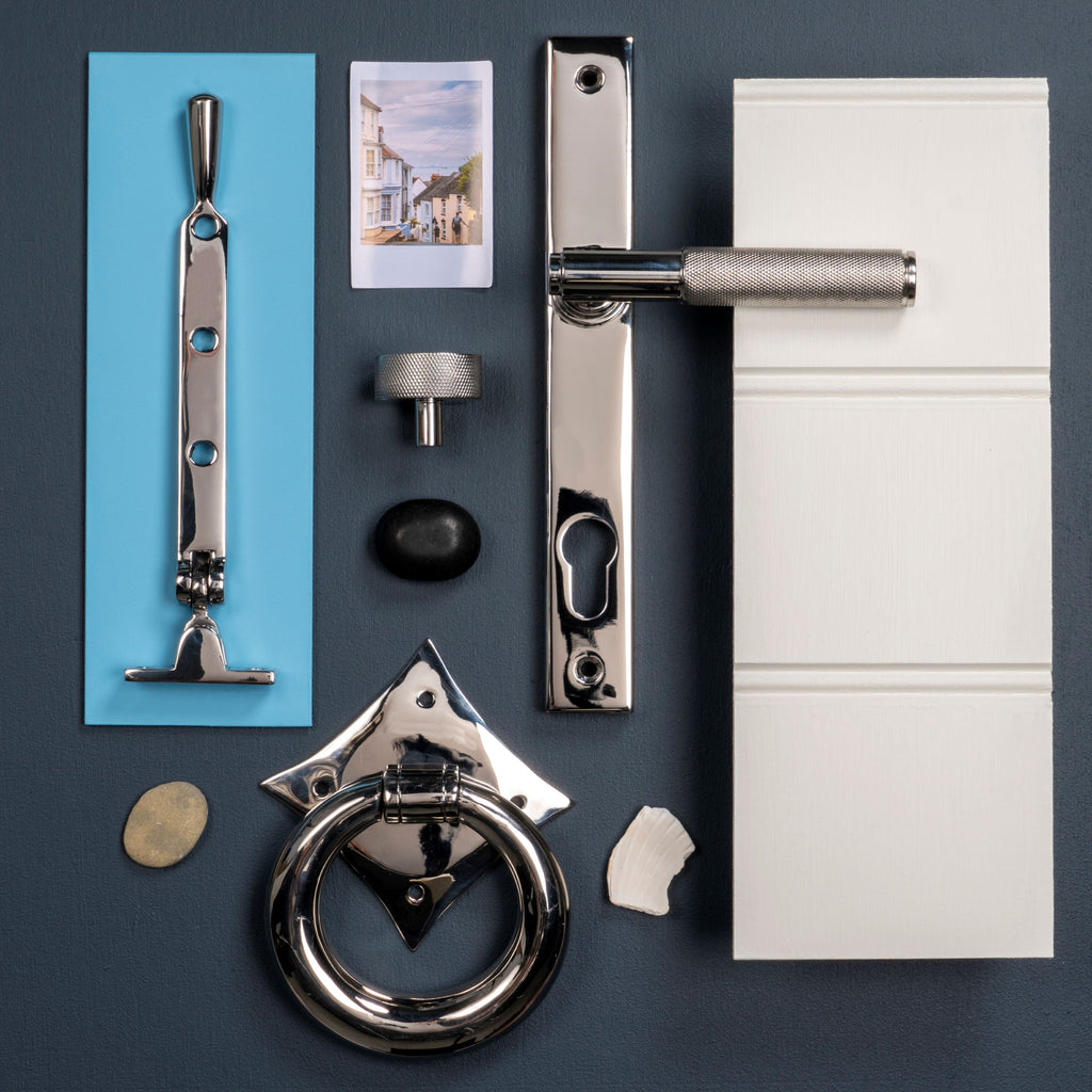 Moodboard of From The Anvil's Polished Stainless Steel door handles, window stays, door knockers, and cabinet handles.