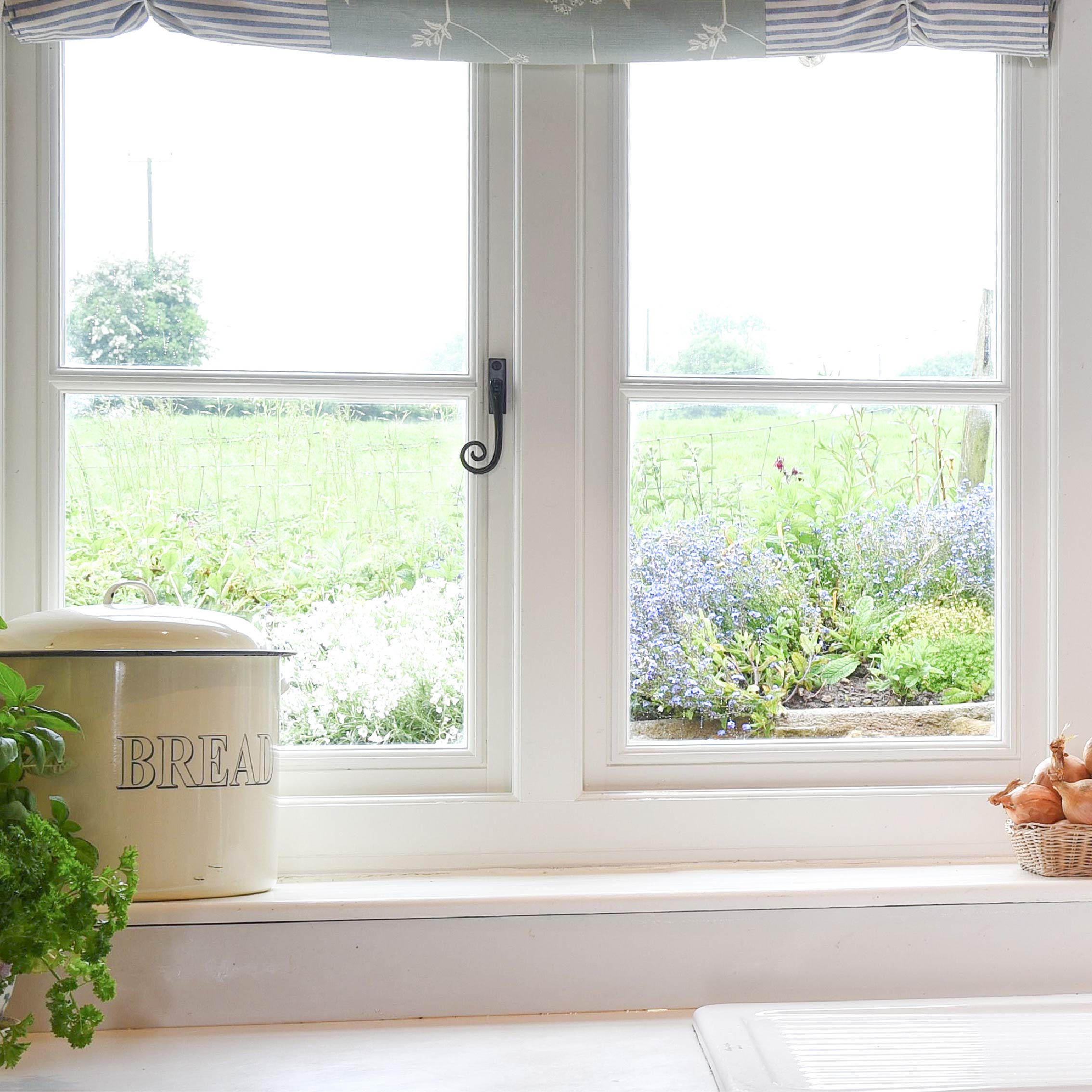 From The Anvil's Black Monkeytail window hardware on a white uPVC window frame