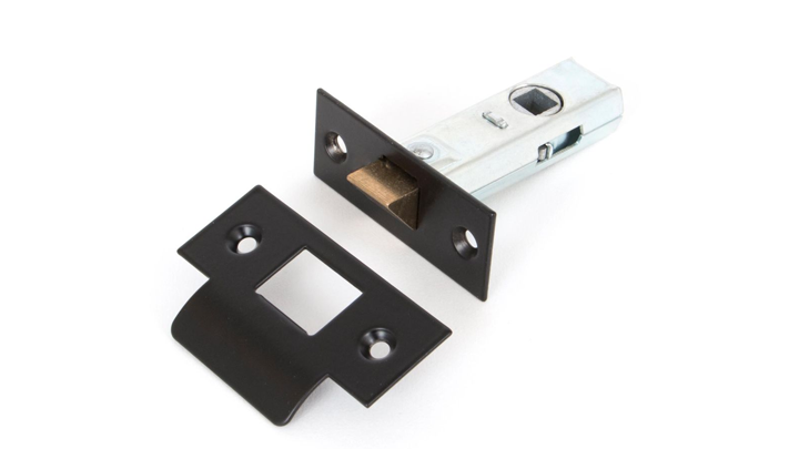 Black heavy duty tubular mortice latch and matching receiver plate on a white background.