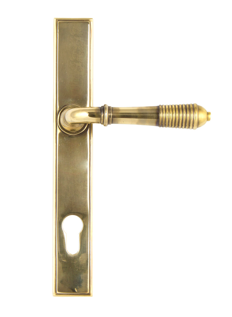 White background image of From The Anvil's Aged Brass Reeded Slimline Lever Espag. Lock Set | From The Anvil