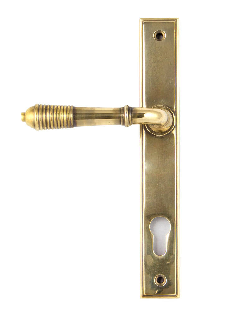 White background image of From The Anvil's Aged Brass Reeded Slimline Lever Espag. Lock Set | From The Anvil