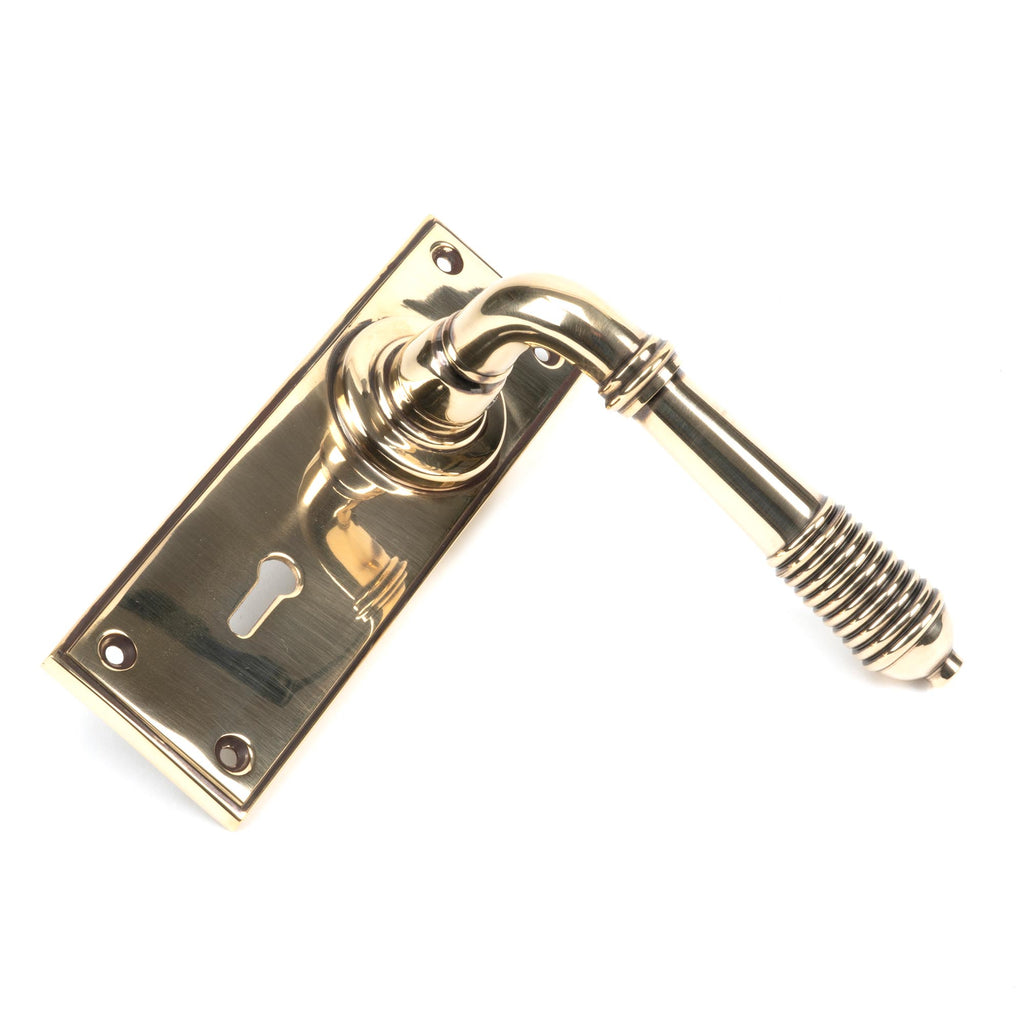 White background image of From The Anvil's Aged Brass Reeded Lever Lock Set | From The Anvil