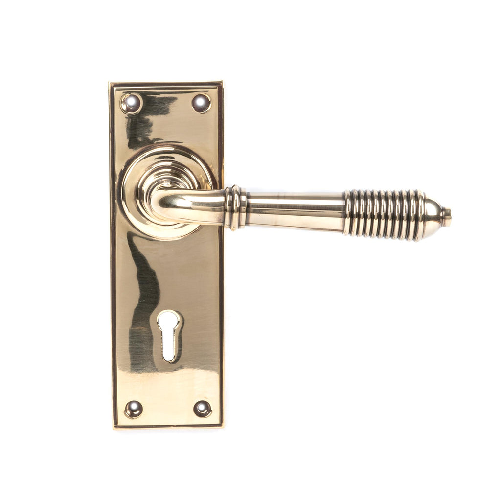 White background image of From The Anvil's Aged Brass Reeded Lever Lock Set | From The Anvil