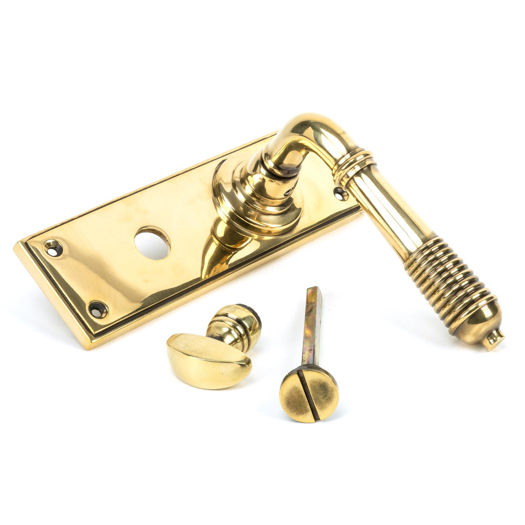 White background image of From The Anvil's Aged Brass Reeded Lever Bathroom Set | From The Anvil