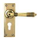 From The Anvil's Aged Brass Reeded Lever Euro Lock Set