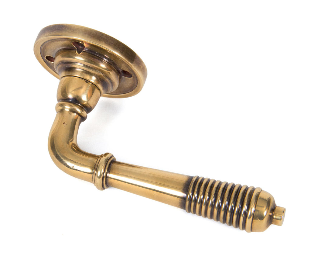 White background image of From The Anvil's Aged Brass Reeded Lever on Rose Set | From The Anvil