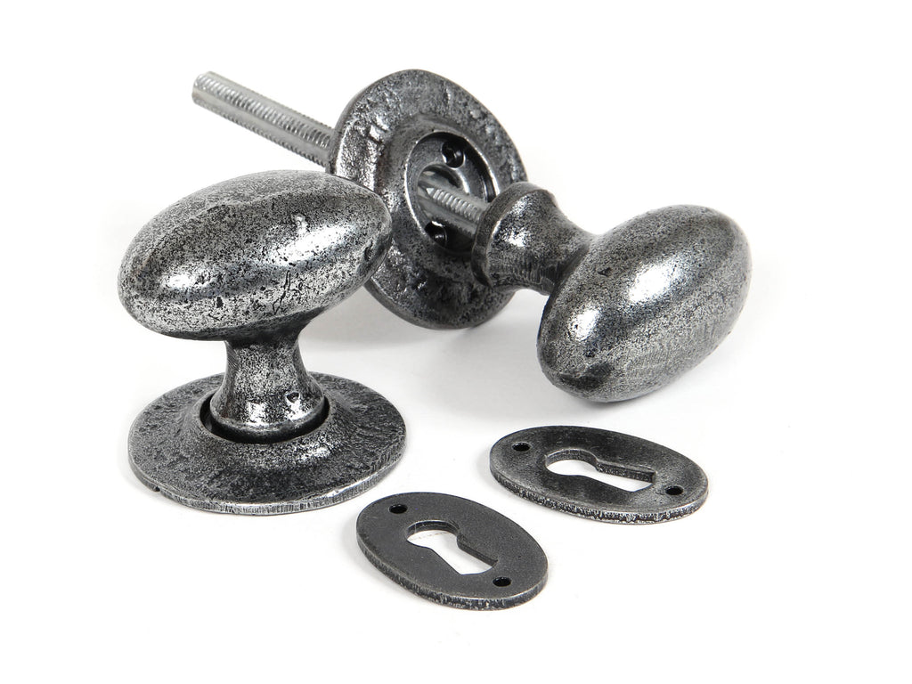 From The Anvil's Pewter Patina Oval Mortice/Rim Knob Set