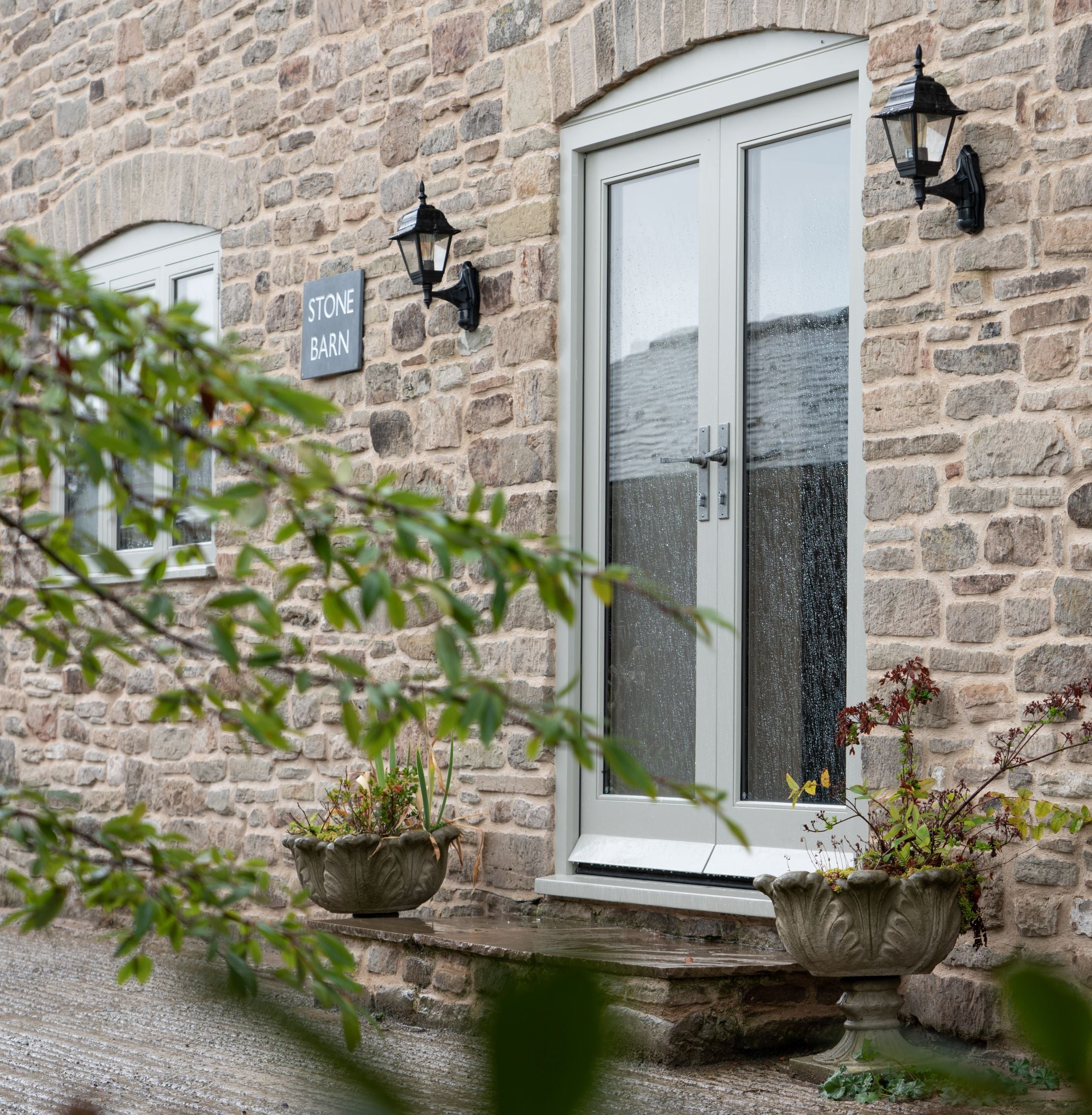 Glazed pair of exterior doors with From The Anvil's Pewter locking door handles.