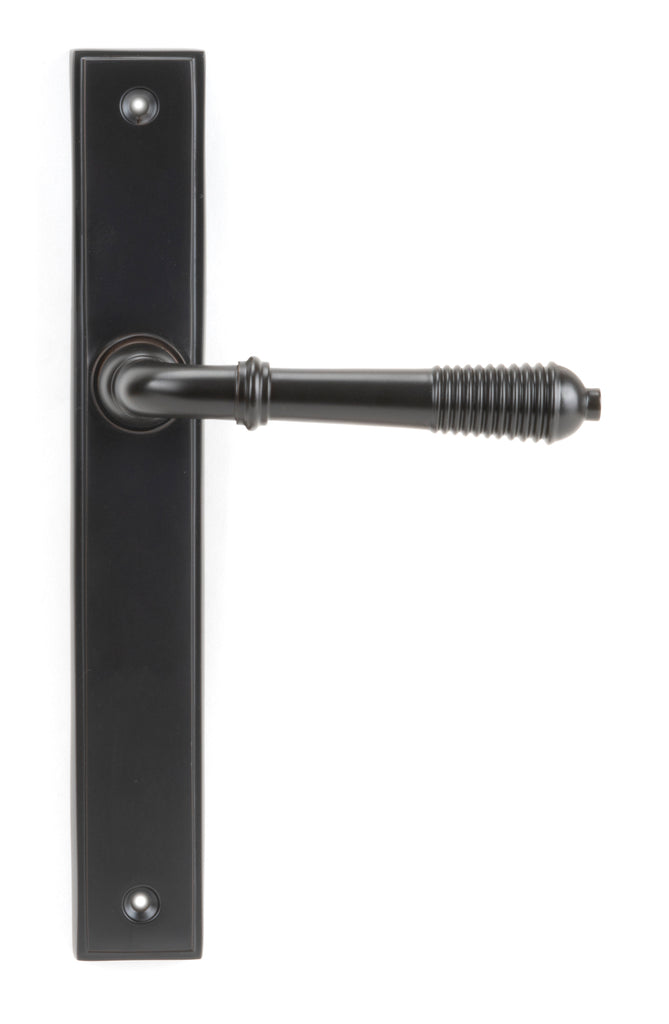 White background image of From The Anvil's Aged Bronze Reeded Slimline Lever Espag. Latch Set | From The Anvil