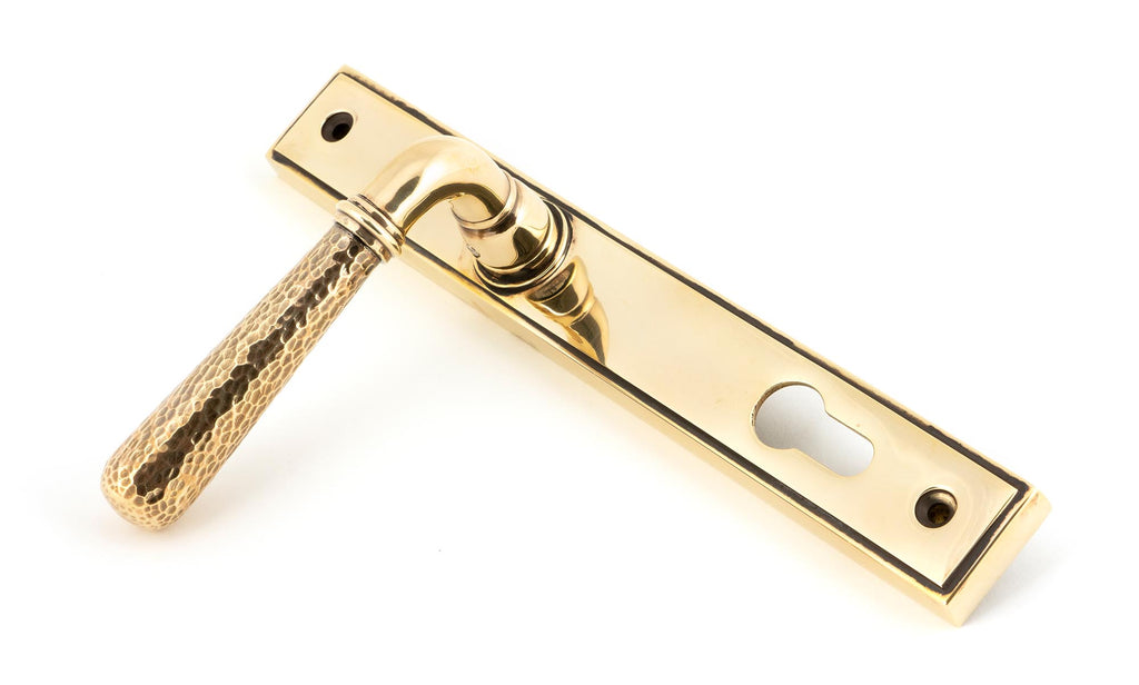 White background image of From The Anvil's Aged Brass Hammered Newbury Slimline Espag. Lock Set | From The Anvil
