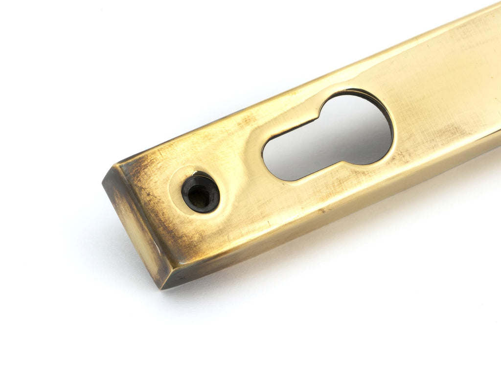 White background image of From The Anvil's Aged Brass Brompton Slimline Lever Espag. Lock Set | From The Anvil