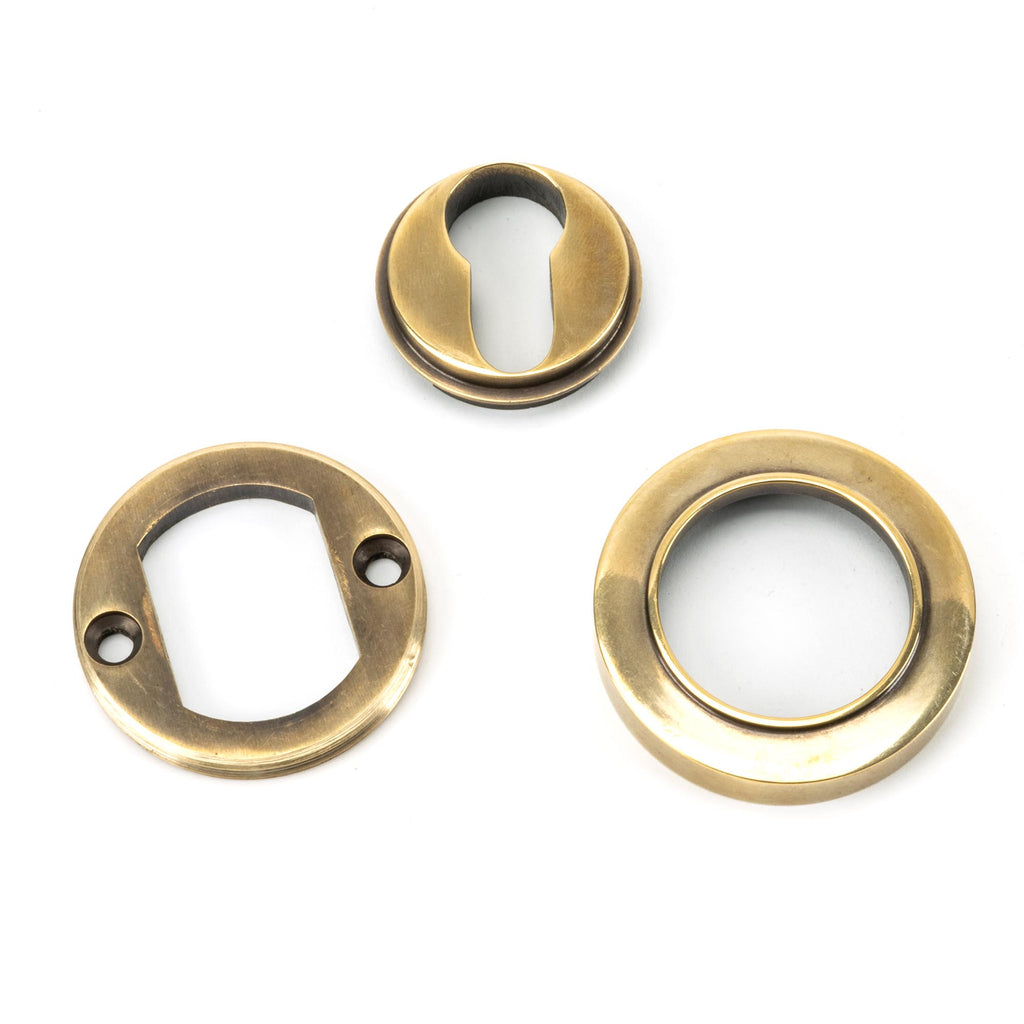 White background image of From The Anvil's Aged Brass Round Euro Escutcheon | From The Anvil