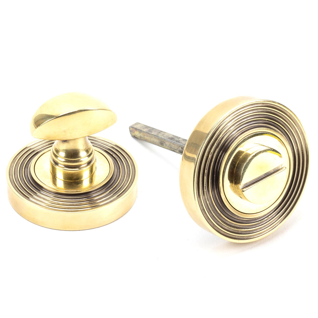 White background image of From The Anvil's Aged Brass Round Thumbturn Set | From The Anvil