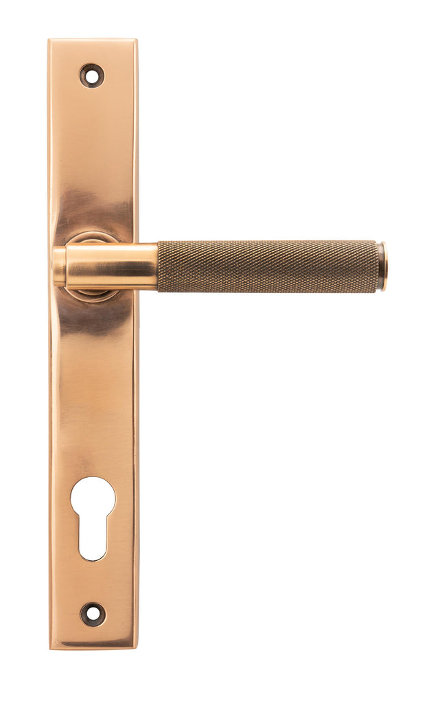White background image of From The Anvil's Polished Bronze Brompton Slimline Lever Espag. Lock Set | From The Anvil