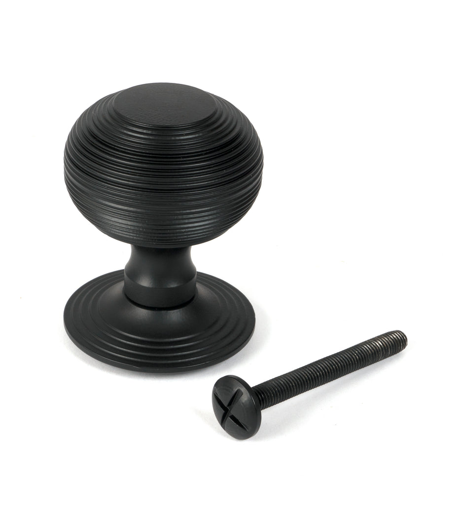 White background image of From The Anvil's Matt Black Beehive Centre Door Knob | From The Anvil