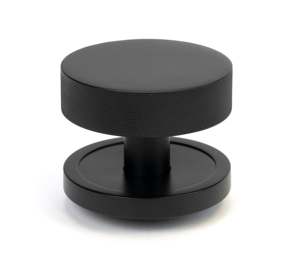 White background image of From The Anvil's Matt Black Brompton Centre Door Knob | From The Anvil