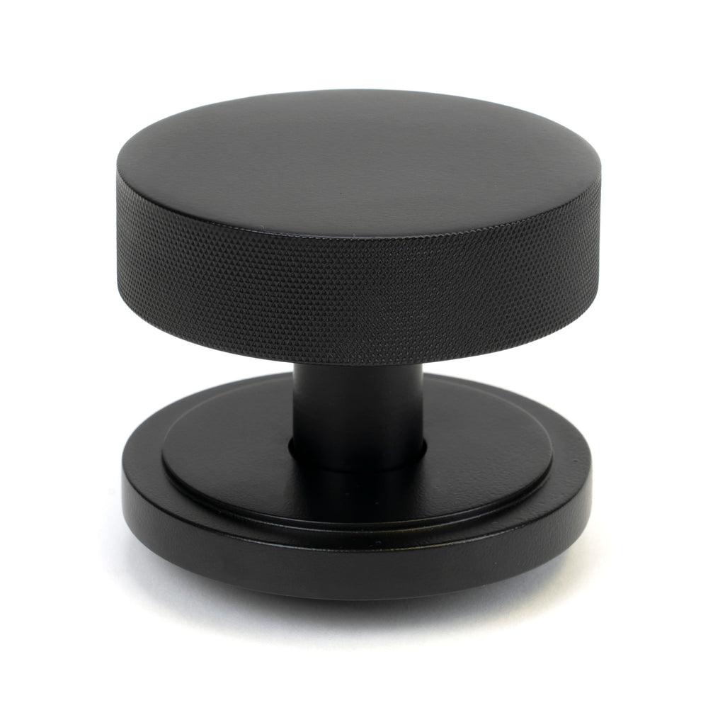 White background image of From The Anvil's Matt Black Brompton Centre Door Knob | From The Anvil