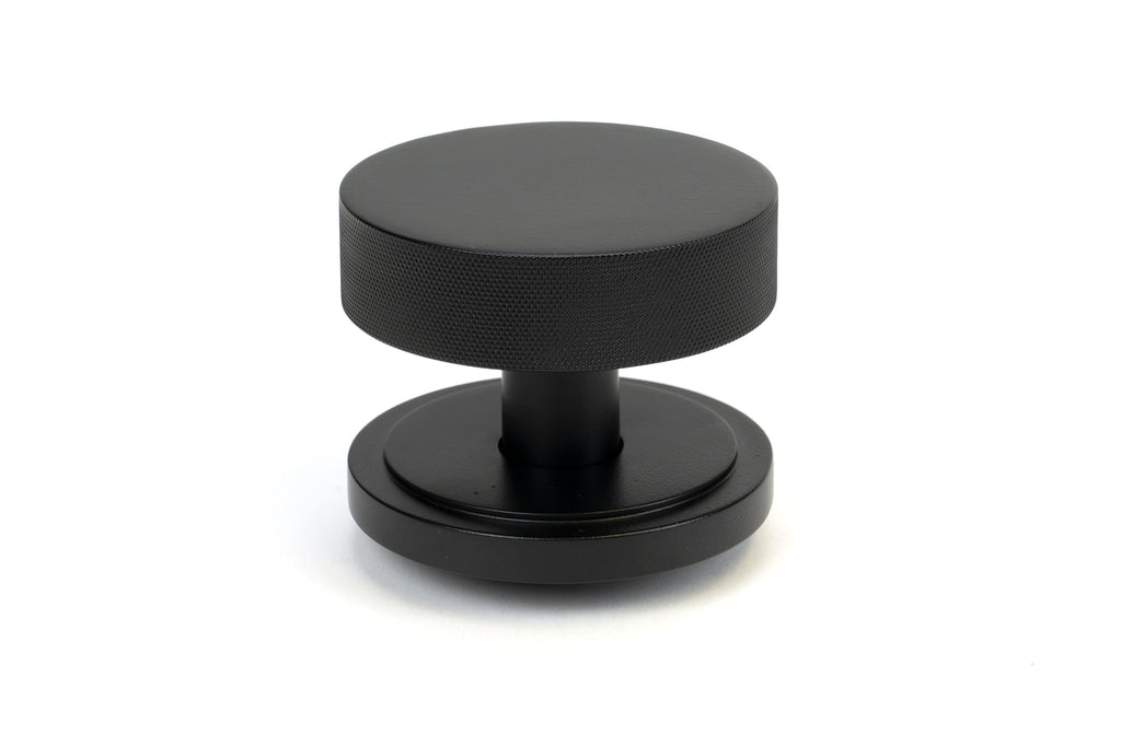 White background image of From The Anvil's Matt Black Brompton Centre Door Knob | From The Anvil