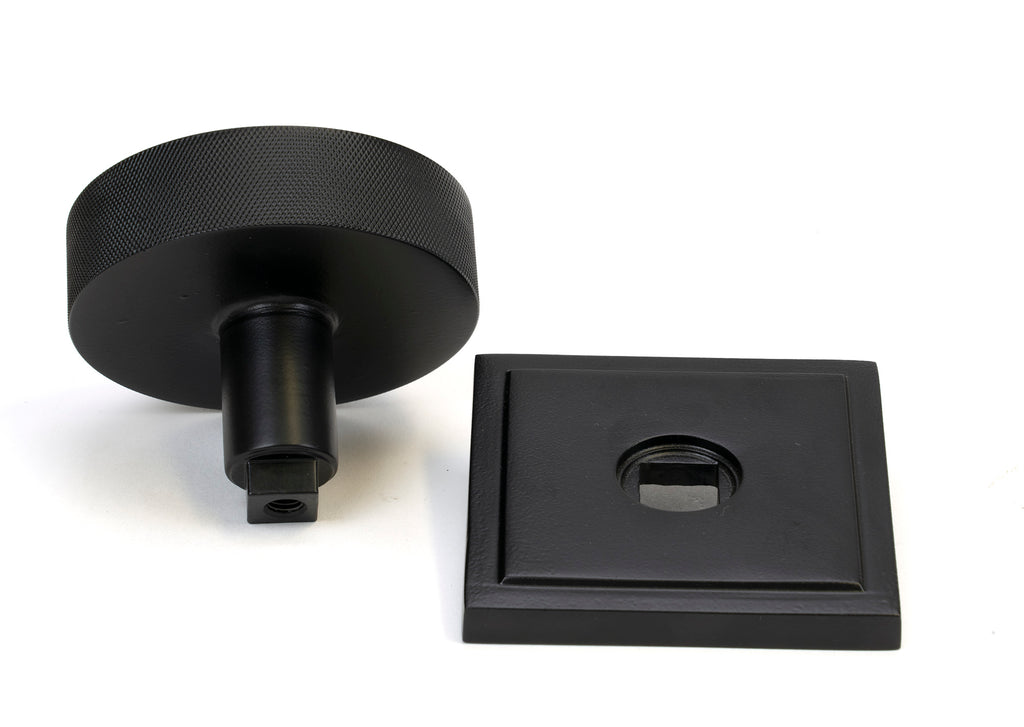 White background image of From The Anvil's Matt Black Brompton Centre Door Knob | From The Anvil