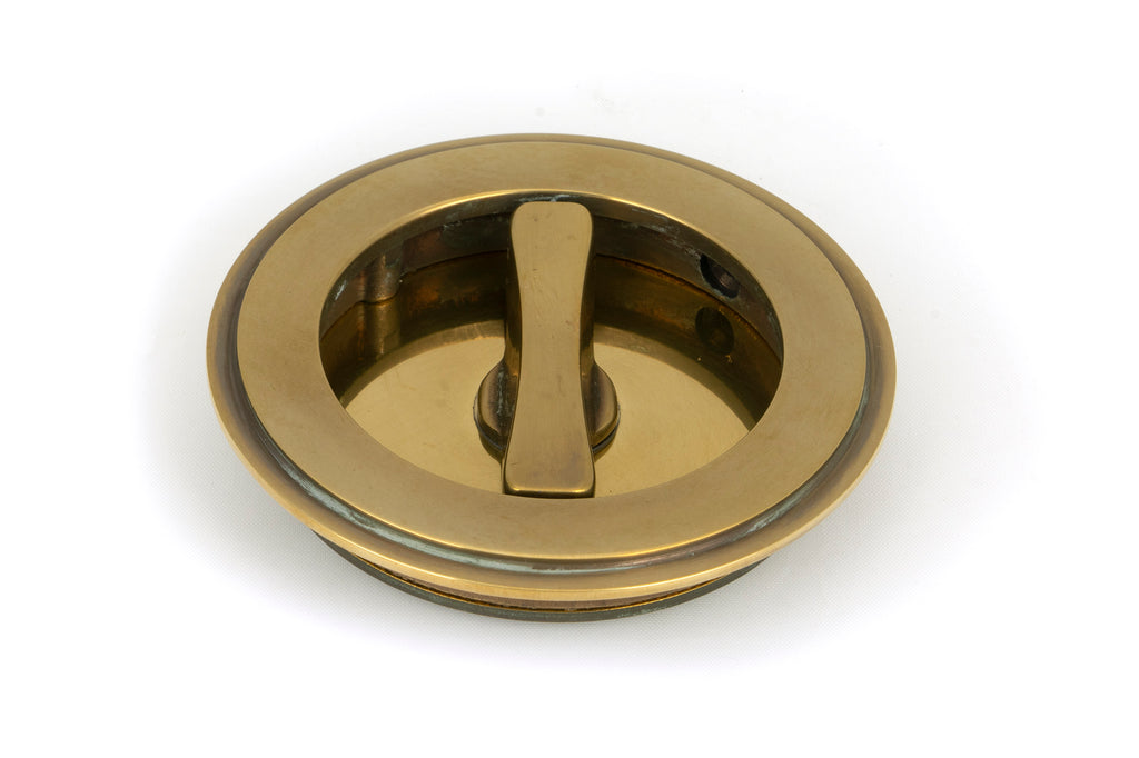 White background image of From The Anvil's Aged Brass Art Deco Round Pull - Privacy Set | From The Anvil