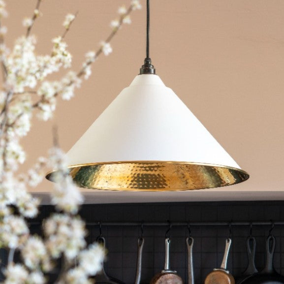 Hammered Brass white painted Hockley ceiling pendant light hanging in a black and neutral kitchen.