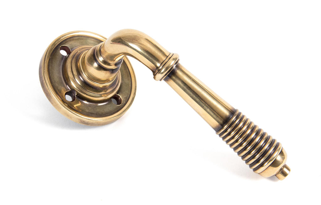 White background image of From The Anvil's Aged Brass Reeded Lever on Rose Set | From The Anvil