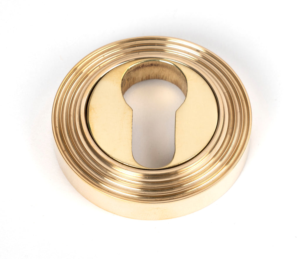 White background image of From The Anvil's Polished Brass Round Euro Escutcheon | From The Anvil