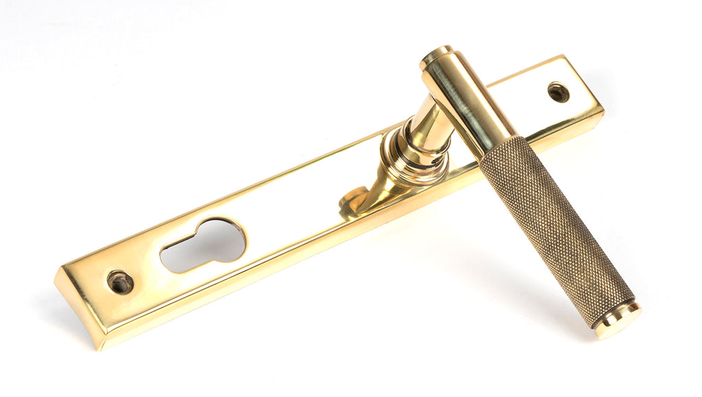 White background image of From The Anvil's Polished Brass Brompton Slimline Lever Espag. Lock Set | From The Anvil