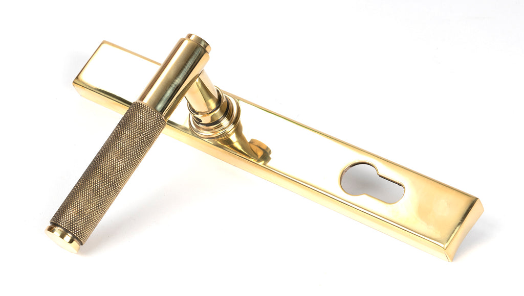 White background image of From The Anvil's Polished Brass Brompton Slimline Lever Espag. Lock Set | From The Anvil