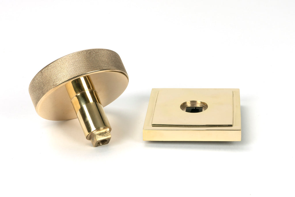 White background image of From The Anvil's Polished Brass Brompton Centre Door Knob | From The Anvil