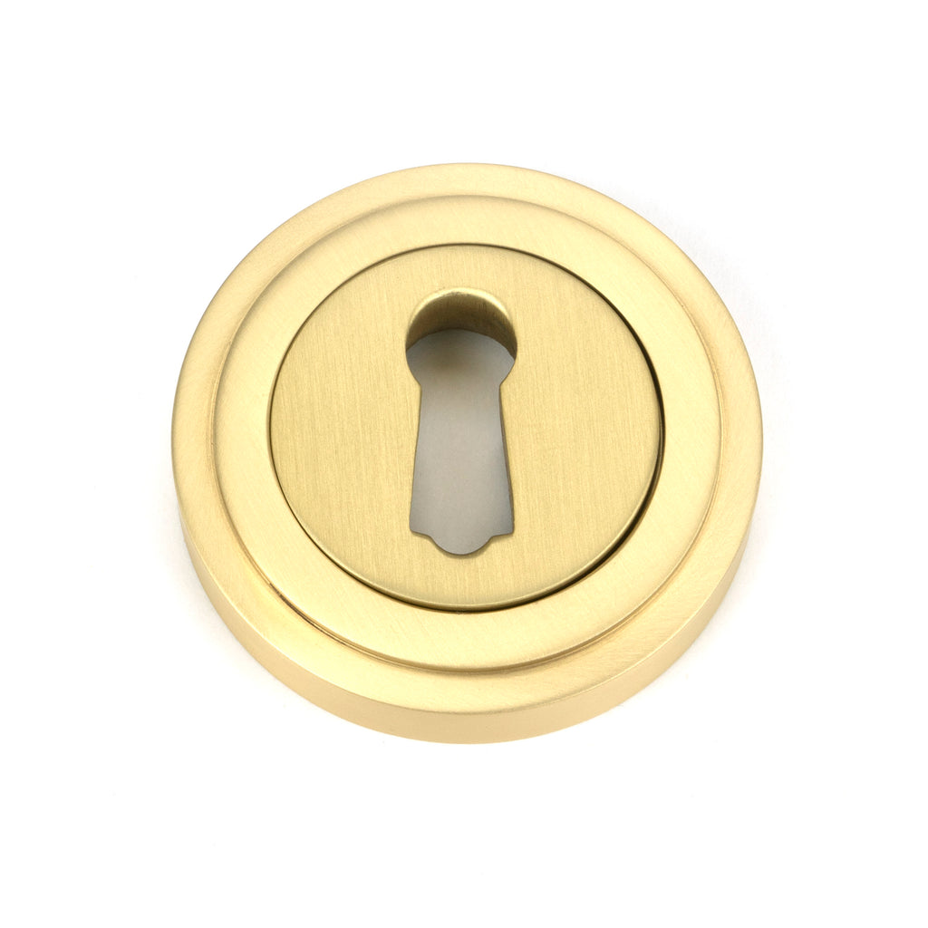 White background image of From The Anvil's Satin Brass Round Escutcheon | From The Anvil
