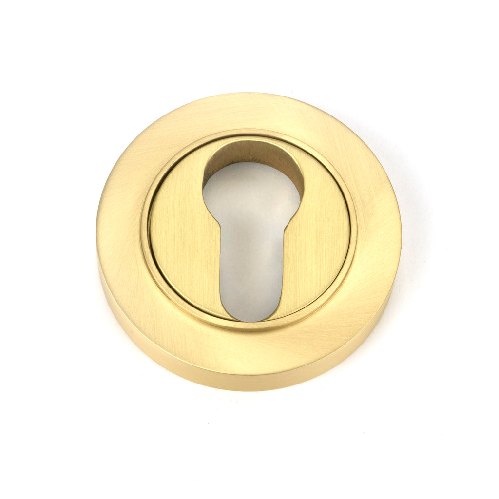 White background image of From The Anvil's Satin Brass Round Euro Escutcheon | From The Anvil