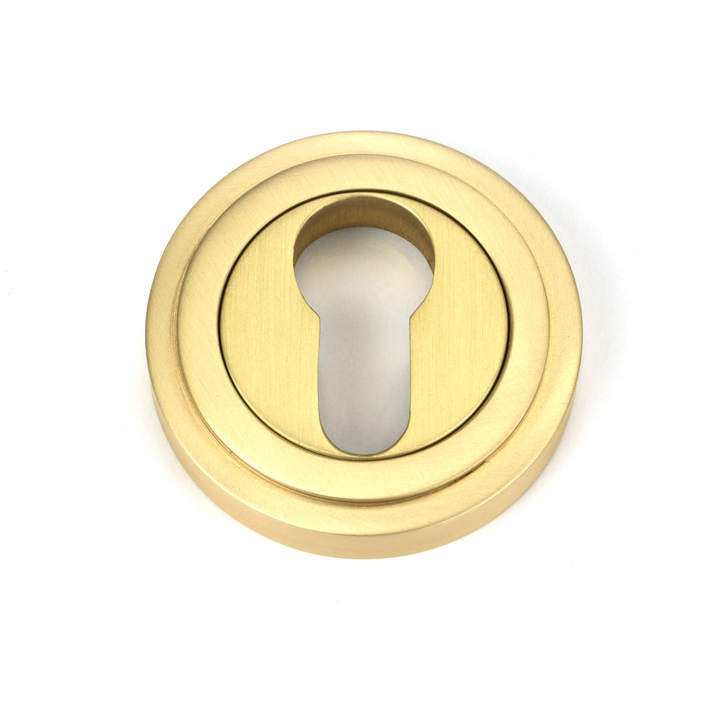 White background image of From The Anvil's Satin Brass Round Euro Escutcheon | From The Anvil