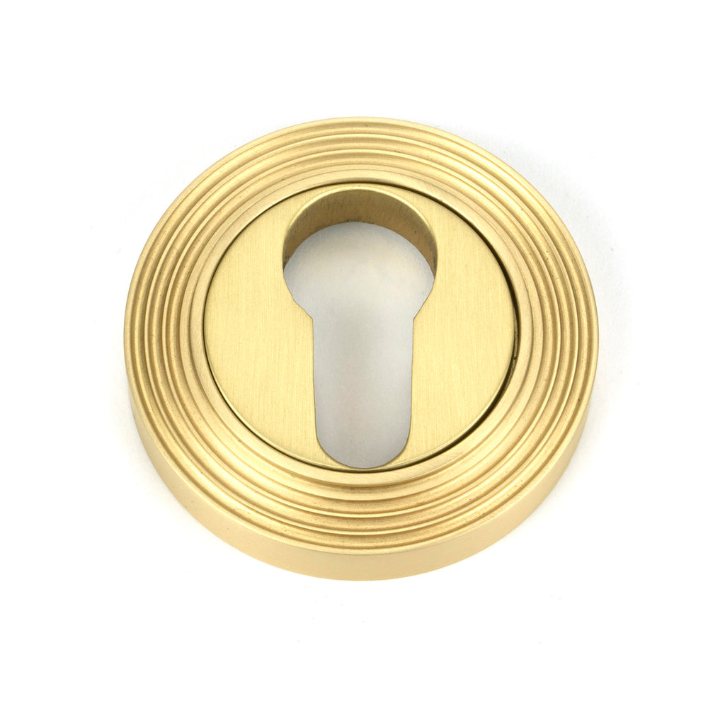 White background image of From The Anvil's Satin Brass Round Euro Escutcheon | From The Anvil