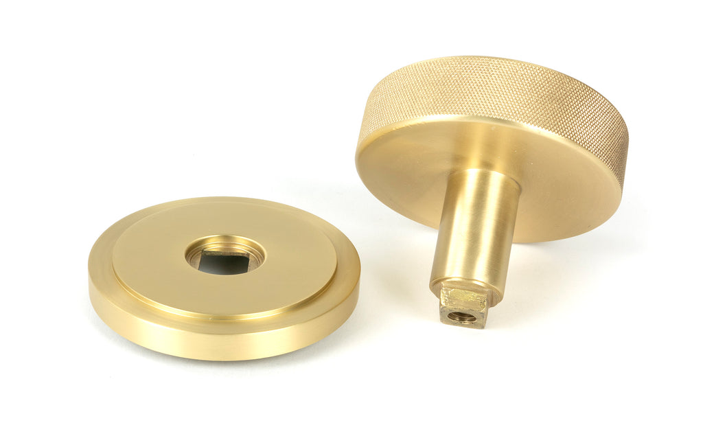 White background image of From The Anvil's Satin Brass Brompton Centre Door Knob | From The Anvil