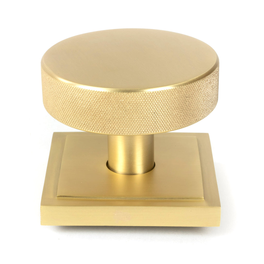 White background image of From The Anvil's Satin Brass Brompton Centre Door Knob | From The Anvil