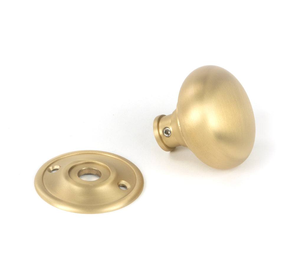 White background image of From The Anvil's Satin Brass Mushroom Mortice/Rim Knob Set | From The Anvil
