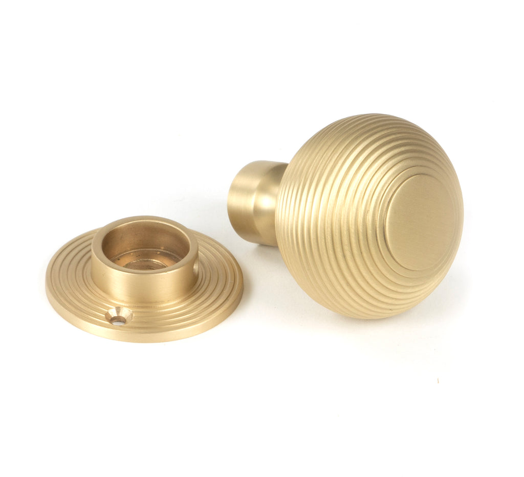 White background image of From The Anvil's Satin Brass Heavy Beehive Mortice/Rim Knob Set | From The Anvil