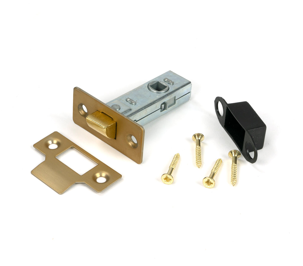 White background image of From The Anvil's Satin Brass 2½" Tubular Mortice Latch